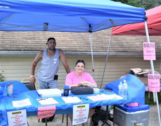 John Canella and Marianne Murphy, cousins of the late Peter Kamper Jr., man the registration table.