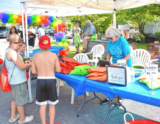 Cotton candy and water were available at the activities table.