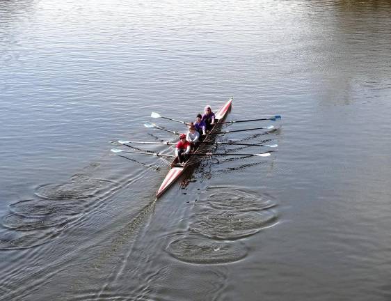 Rowers in a four-person boat.