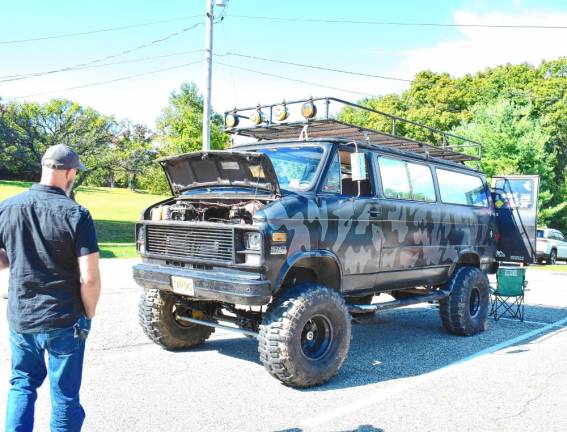 A big four-wheel-drive custom van on display.