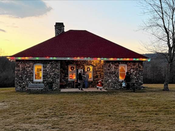 The Wallisch Homestead’s Creamery is lit up from 5 to 9 each evening in December so people can peek through the windows and see how Christmas used to be celebrated. (Photos by Denise von Wilke)