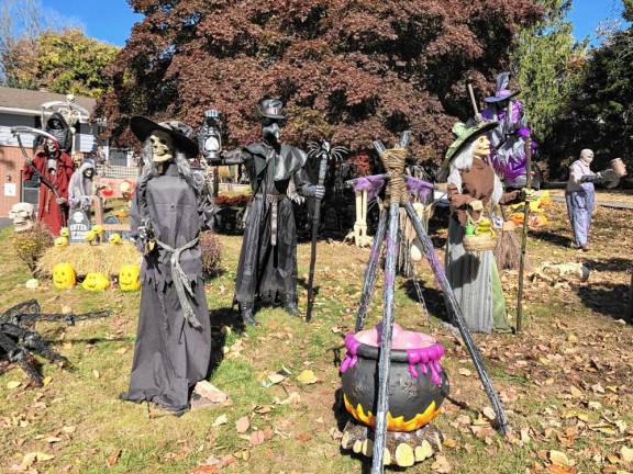 <b>Dozens of figures are set up in front of this home at Main and Clarkson streets in Newton. (Photo by Kathy Shwiff)</b>