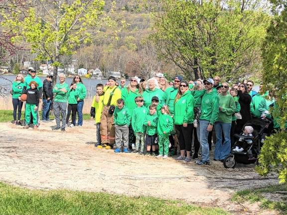 Participants in the Irish Whisper Walk of Hope pose for a photo in the shape of a shamrock. (Photo by Kathy Shwiff)