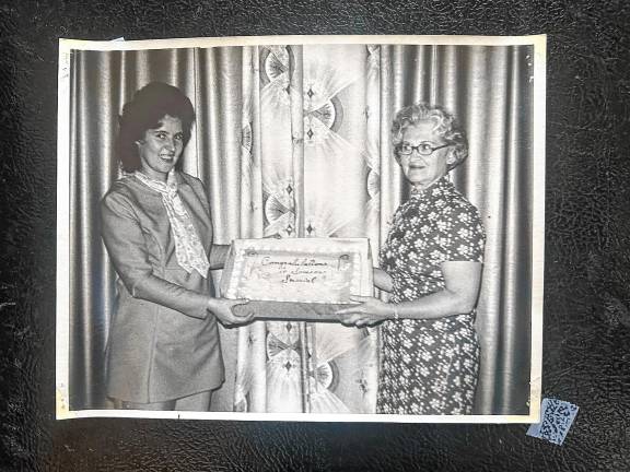 The note on a cake honoring school nurse Eileen Upton, right, in 1973 says, ‘Congratulations to someone special.’ The cake was presented by Marshall Hill School PTA president Charlotte Steifel. (File photo by Ann Genader)