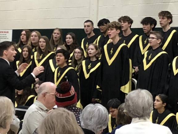 HP2 Dwight Weaver, left, conducts the West Milford High School Highlands Chorale Concert Choir at the township Recreation Center. About 150 senior citizens attended the performance and pizza lunch afterward.