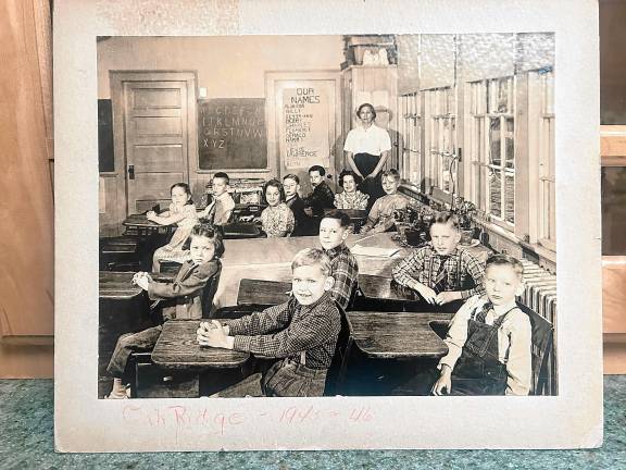 ICE2 Primary grade teacher Alice Greenwood with her class in the Oak Ridge two-room school in the 1945-46 school year. (Photo courtesy of Ann Genader)