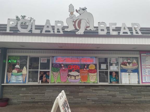 From left, employees Ethan, Zac and Jolie await customers at Polar Bear Ice Cream in Matamoras, Pa. (Photos by Hunter Sickler)