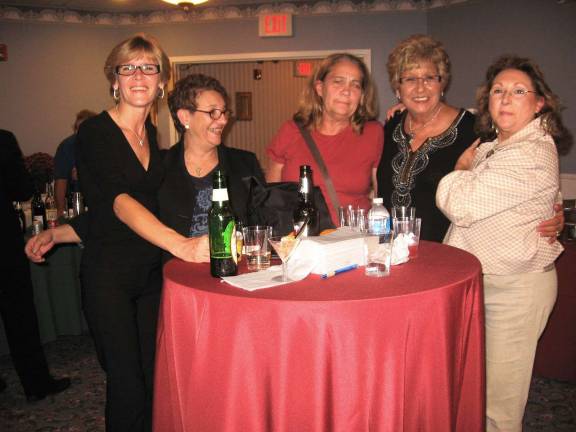 From left, Tracy Meeker, JoAnn Carroll, Linda Gaurino, Cookie Giordano, and Fran Turner enjoy the delicious foods donated by the nine local restaurants, all to raise money for Autism Speaks.