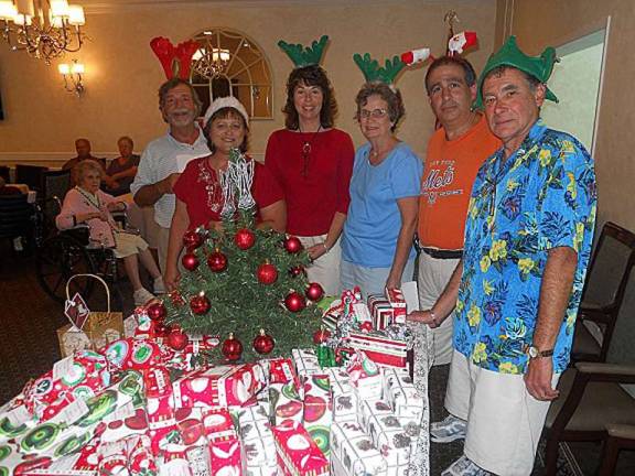 Members of West Milford Rotary Club, from left, Rob Jones, Joann Tenhoeve, Margo Watson, Marilyn Lichtenberg, Glenn Gross and Alan Edelstein, brought joy to the residents of The Chelsea at Bald Eagle and Milford Manor Nursing and Rehabilitation Center.