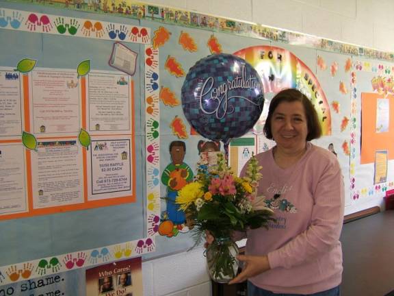 Angela Abdul celebrates a grant that was awarded to the Association for Special Children and Families, based in Hewitt.