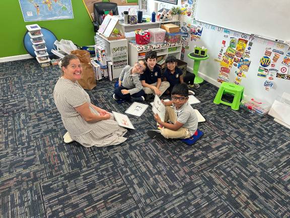 Echo Lake Christian Academy teacher Beth Heinzelmann with students.