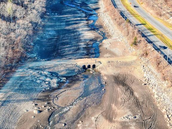 A bridge usually covered by water is visible in the Oak Ridge Reservoir in Jefferson on Monday, Nov. 18. The water level has been lowered for maintenance work and does not reflect the effects of the drought. (Photo by Nick Horton, www.thepathfinderstudios.com)