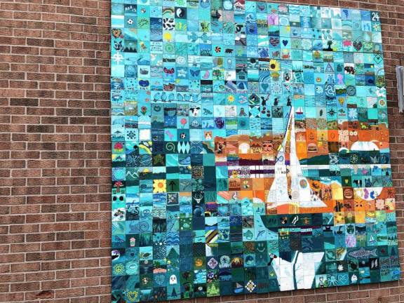 The Greenwood Lake Community Art Project is hanging on the wall outside the municipal building, 18 Church St., Greenwood Lake, N.Y. (Photo by Kathy Shwiff)