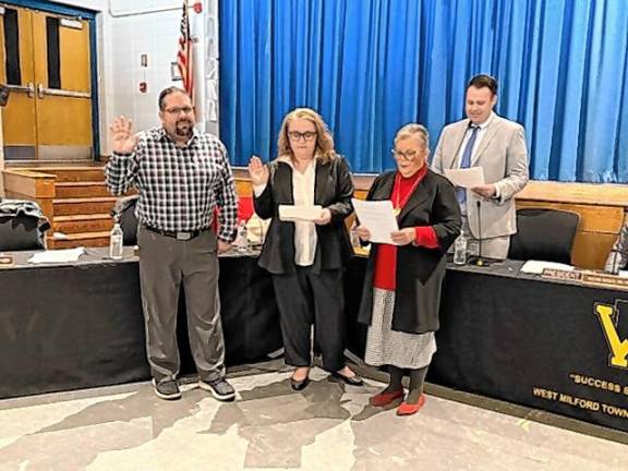 From left, Ray Guarino, Claire Lockwood and Teresa Dwyer are sworn in for three-year terms on the West Milford Board of Education at its annual reorganization meeting Thursday, Jan. 2. (Photo by Denise von Wilke)