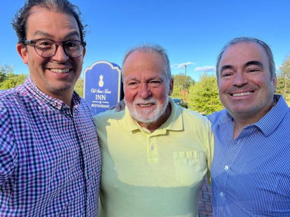 Alejandro and Joe Jr. flank their dad Joe Santandrea.