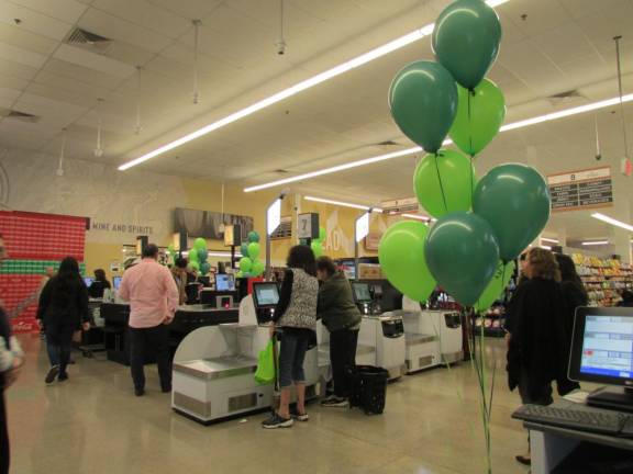 Locals check out Cosmo’s Fresh Market. The new grocery store, located in the old A&amp;P, opened for business on Nov. 11. Photo: Ann Genader