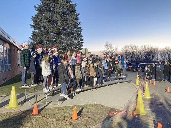 Upper Greenwood Lake Elementary School students perform holiday songs before the tree lighting.