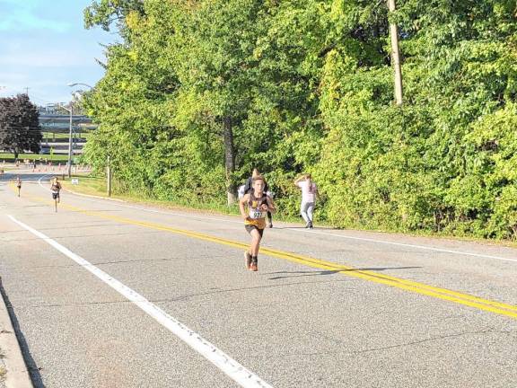 Boy wins 5K benefiting schools