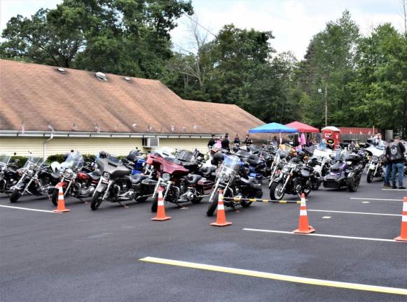 Motorcycles are parked outside the Frank M. Sell American Legion Post 289 in West Milford.