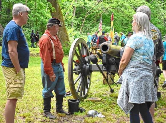 Pvt. Paul Brinkman tells visitors about the 1863 cannon.