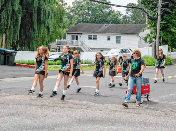 Irish step dancers march in the parade. (Photo by Nancy Madacsi)