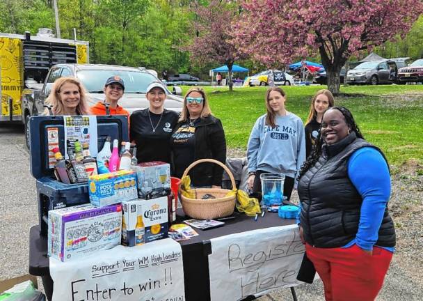 Organizers of the second annual Car Show, Food Truck and Vendor Fair hosted by the West Milford High School Parent-Teacher-Student Organization pose for a photo.