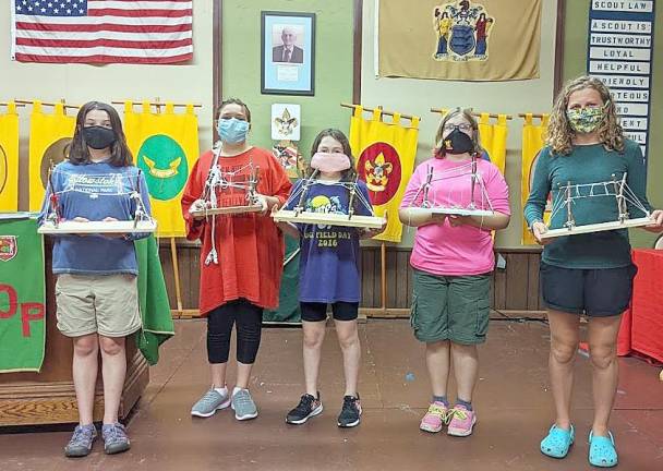 Pictured from left to right are members of Troop 44 G: Julia Schnibbe, Bella Rupprecht, Ella Durland, Lillian Bobrowski and Annie Krukis displaying their Pioneering Badges.