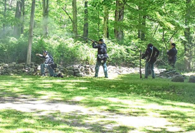 Woefully outnumbered, the 6th New Hamphire Volunteers return fire during a Civil War battle re-enactment at Long Pond Ironworks in Hewitt. (Photos by Fred Ashplant).