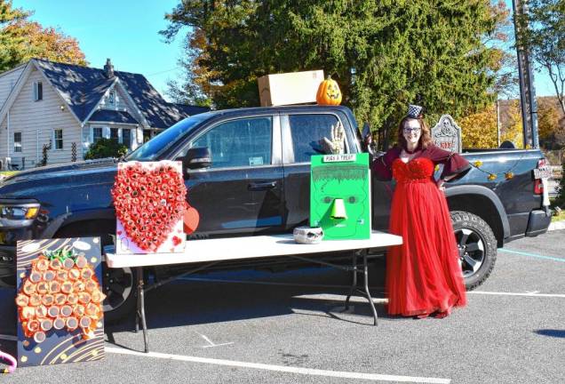 Barbara Magzy with several interactive displays of treats.