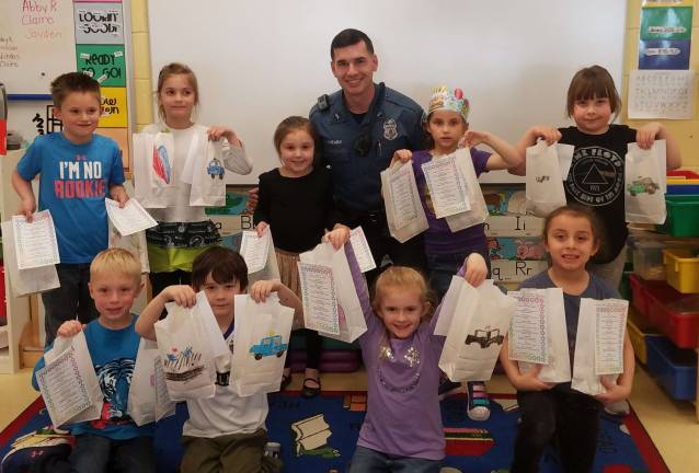 Photo providedWest Milford Police Officer Onembo stopped by the kindergarden class at Maple Road School to receive snack bags of appreciation.