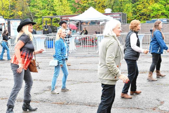 Attendees dance to the music. (Photo by Maria Kovic)