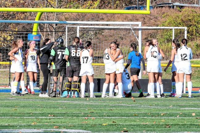 West Milford players console one another after their heart-breaking loss to Pompton Lakes in the county championship.