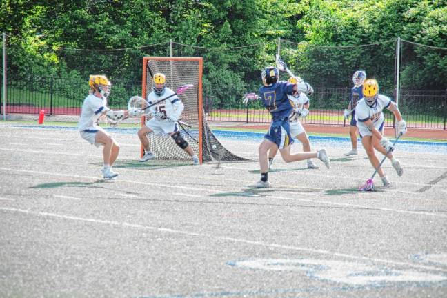 BL2 Ramsey's Owen Crowley (7) fires the ball toward the net. He scored one goal in the game.