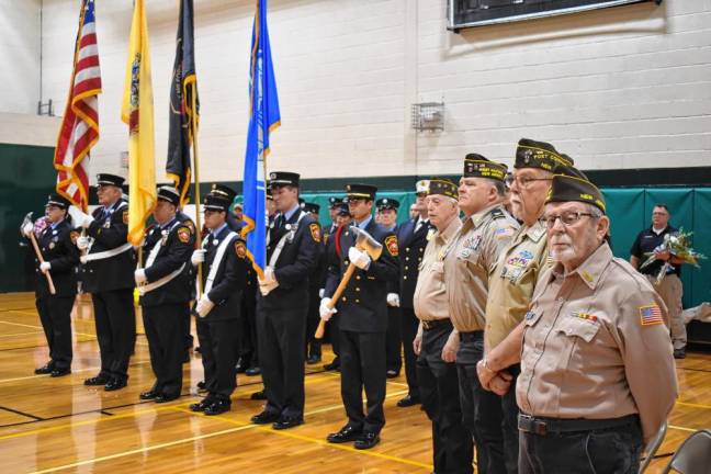 At left is the West Milford Fire Department Color Guard. At right are veterans.