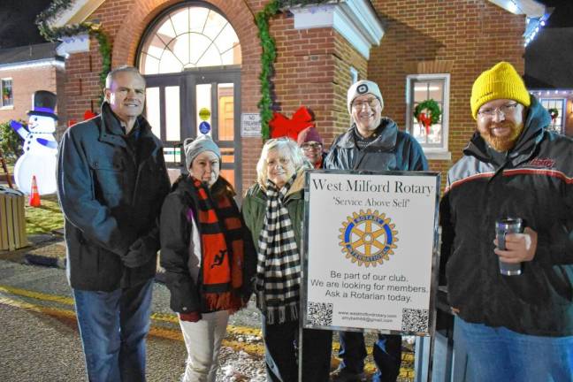 Members of the West Milford Rotary provide hot chocolate to residents at the tree lighting.