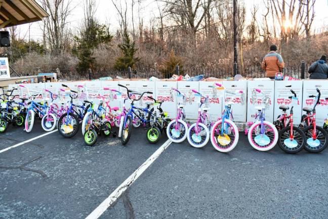 <b>OT3 New bikes and other donated toys are lined up to be loaded on the train. They will be distributed to underprivileged</b> children by the U.S. Marine Corps Reserve’s Toys for Tots Foundation. (Photo by Maria Kovic)