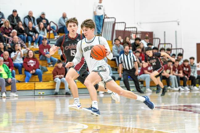 Highlanders’ Cole Stillman drives over mid-court after making a steal in PCT quarterfinal action against Wayne Hills on Saturday.