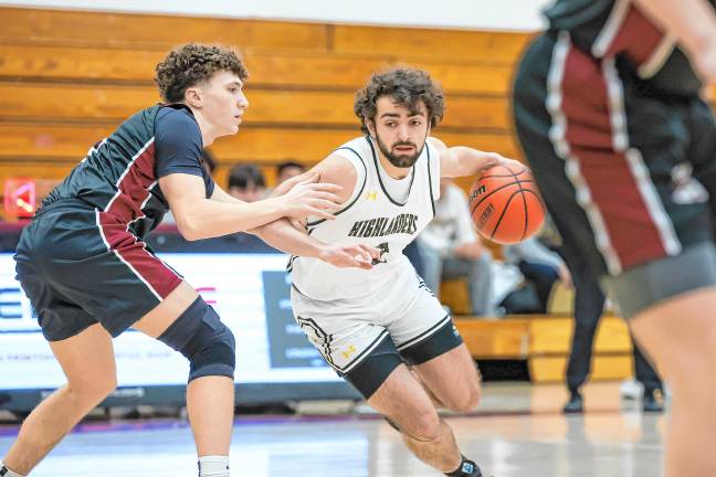 West Milford’s Dean Deaver drives to his left into the lane during first-quarter action against Wayne Hills on Saturday, Feb. 15.