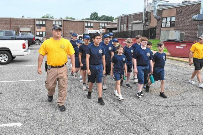 The cadets march in formation.