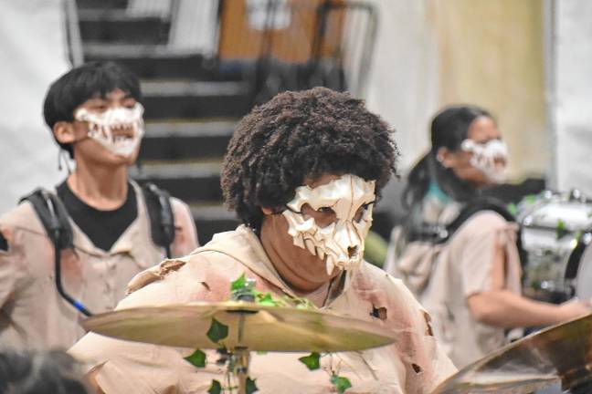 Bergenfield High School students play while wearing masks.