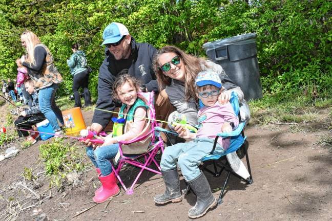 Charles and Cheryl O’Brien fishing with their children Conor and Collins.