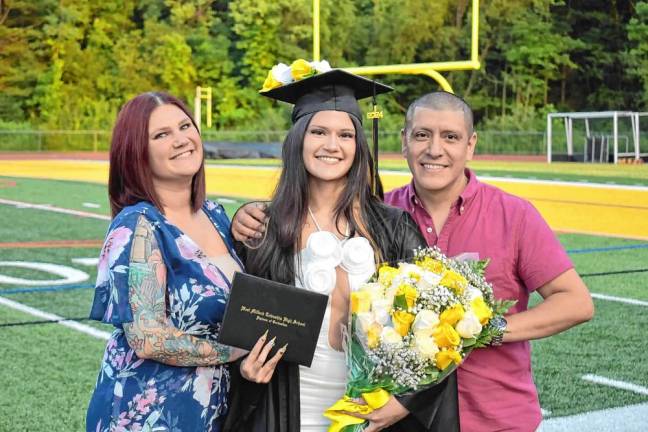Graduate Nyla Morquecho poses with her mother, Honesty Sollitto, and father, Richard.