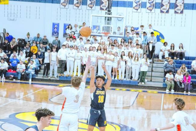 Jefferson's Noah Dela Cruz releases the ball during a shot. He scored 14 points.