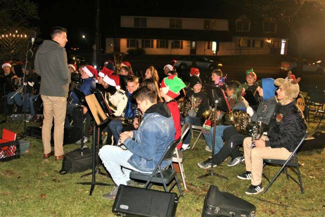 The West Milford High School Band performs Christmas music during the tree lighting ceremony Monday night.