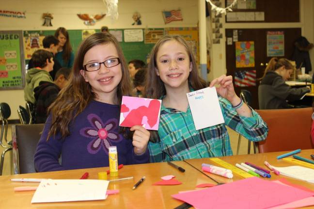 Hailey and Rachel show some of the cards they made for the residents at Wanaque Center.