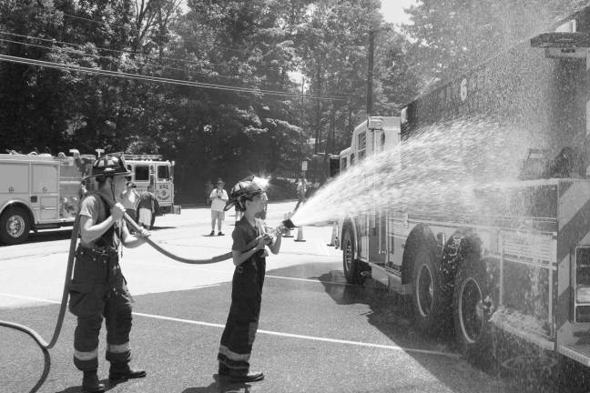 Tanker 6 gets hosed. Photo by Ginny Raue