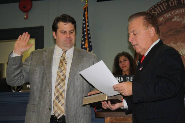 State Senator Joseph Pennacchio, right, swears in Councilman Mike Hensley. This is Hensley's second term in office.