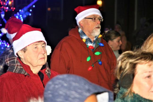 Evelyn Martin and Dave DeLucca show their holiday spirit during the tree lighting ceremony.
