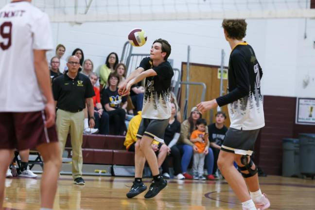 VB7 Matt Landoline bumps a Summit serve in the first game.