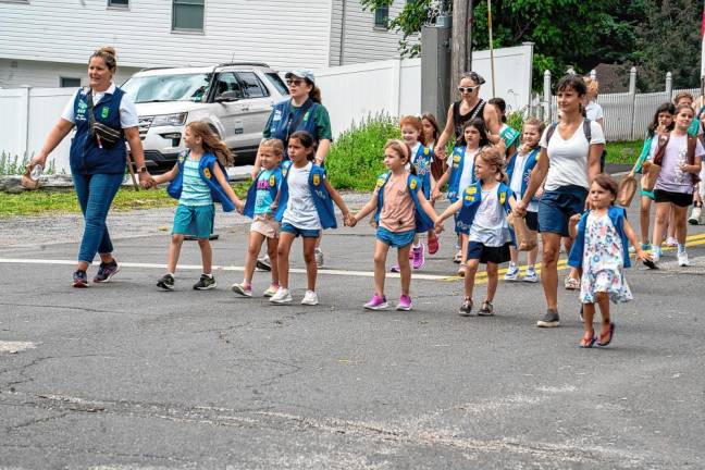 Girl Scouts march in the parade. (Photo by Nancy Madacsi)